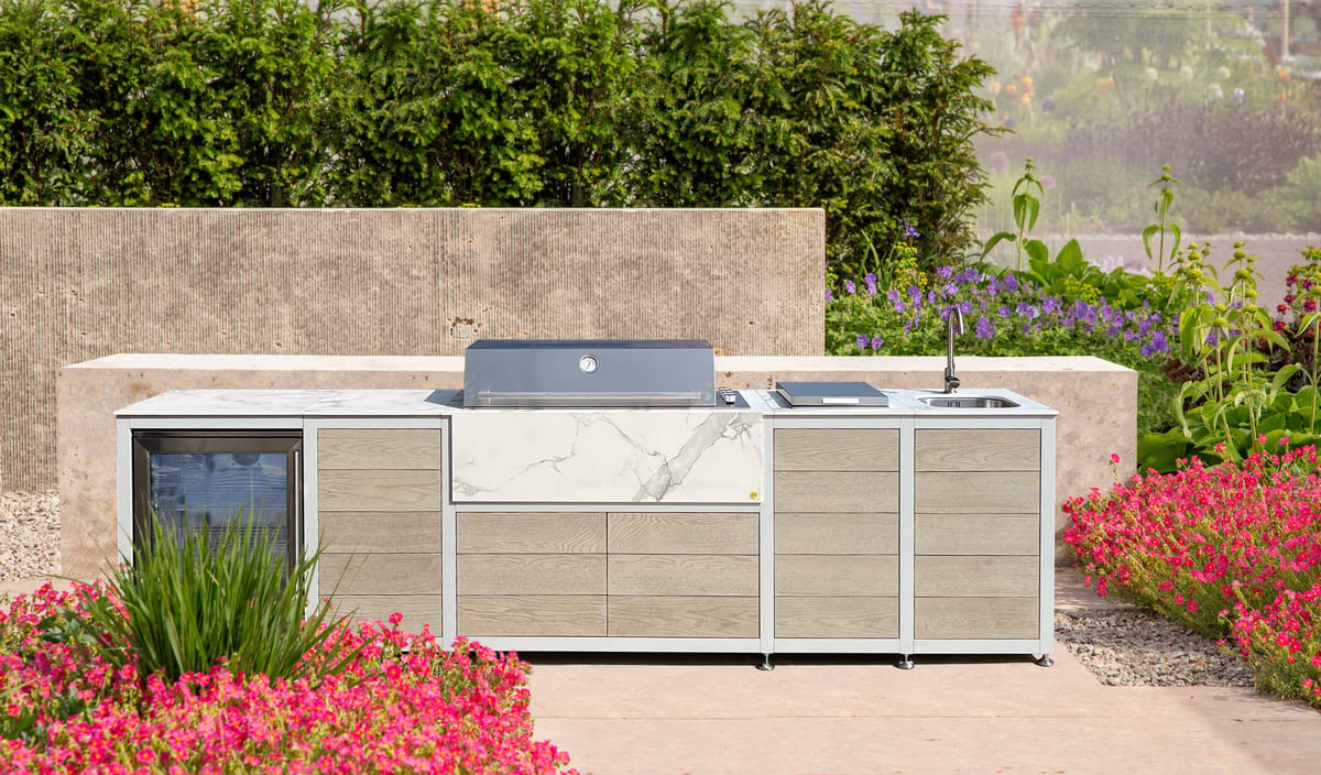 EO Modular outdoor kitchen surrounded by pink flowers