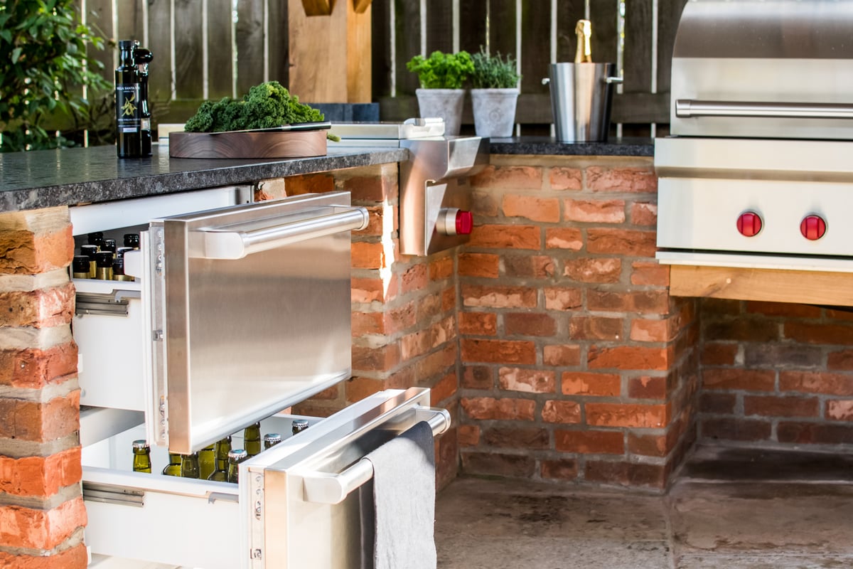 Chilled draws built into a brick outdoor kitchen